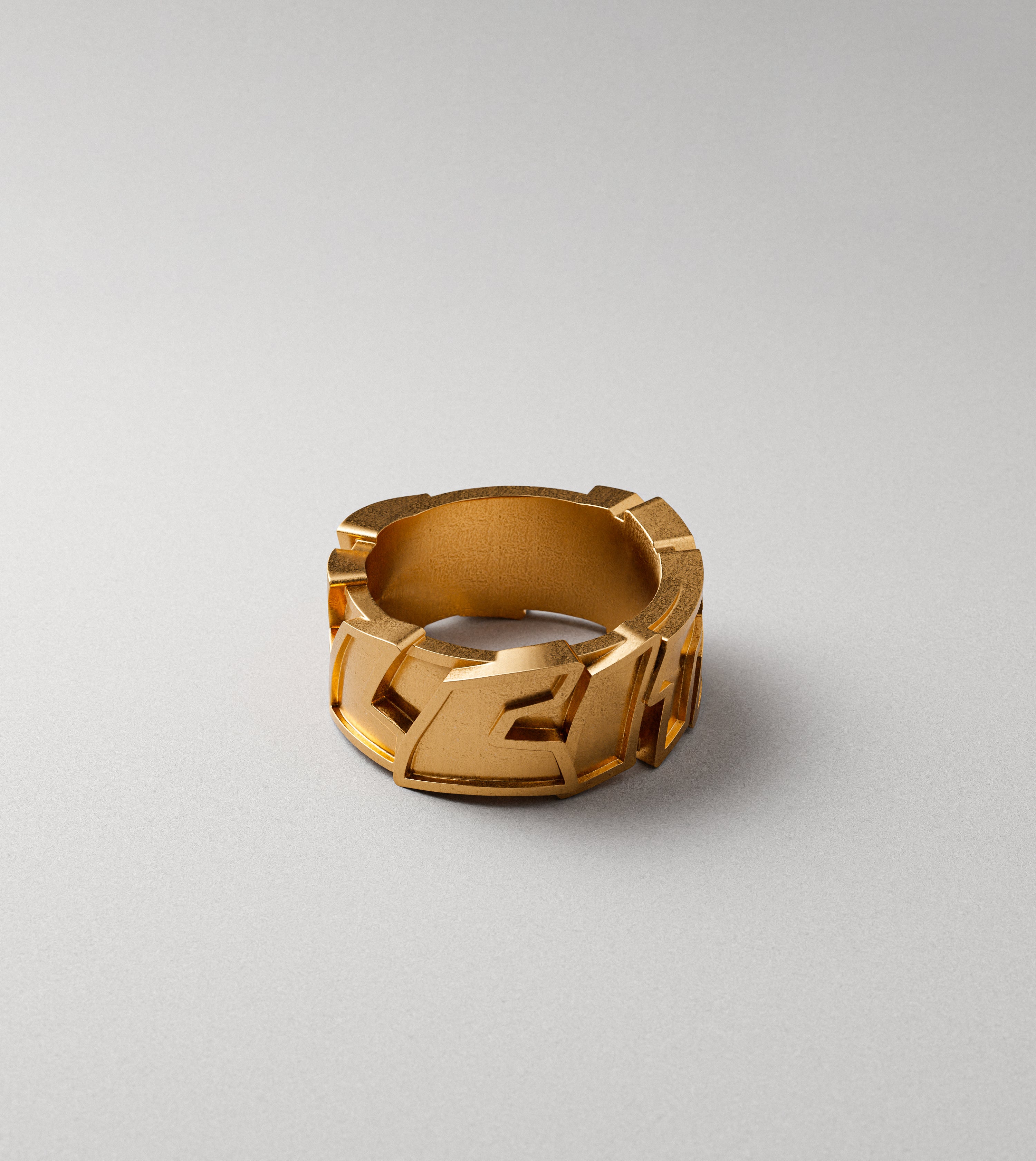 All City block letters gold ring by Cast Pieces, angled view