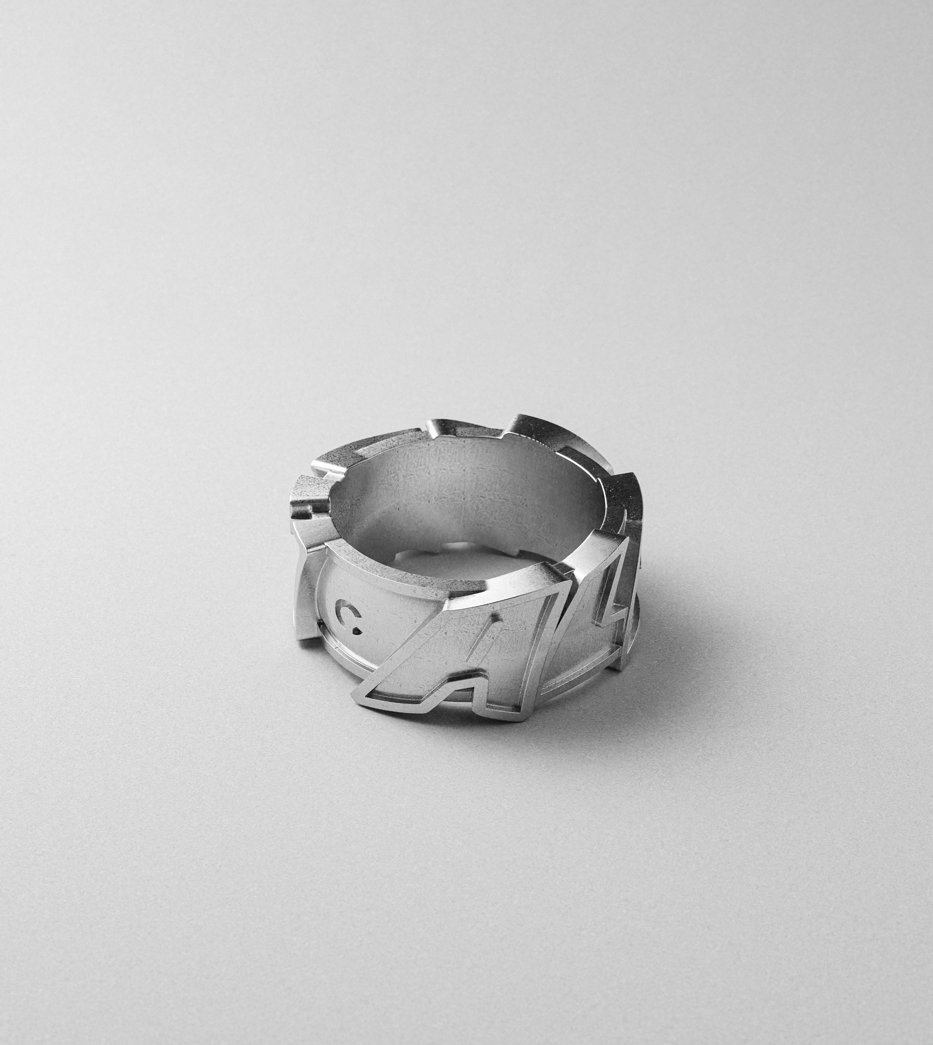 All City block letters silver ring by Cast Pieces, angled view