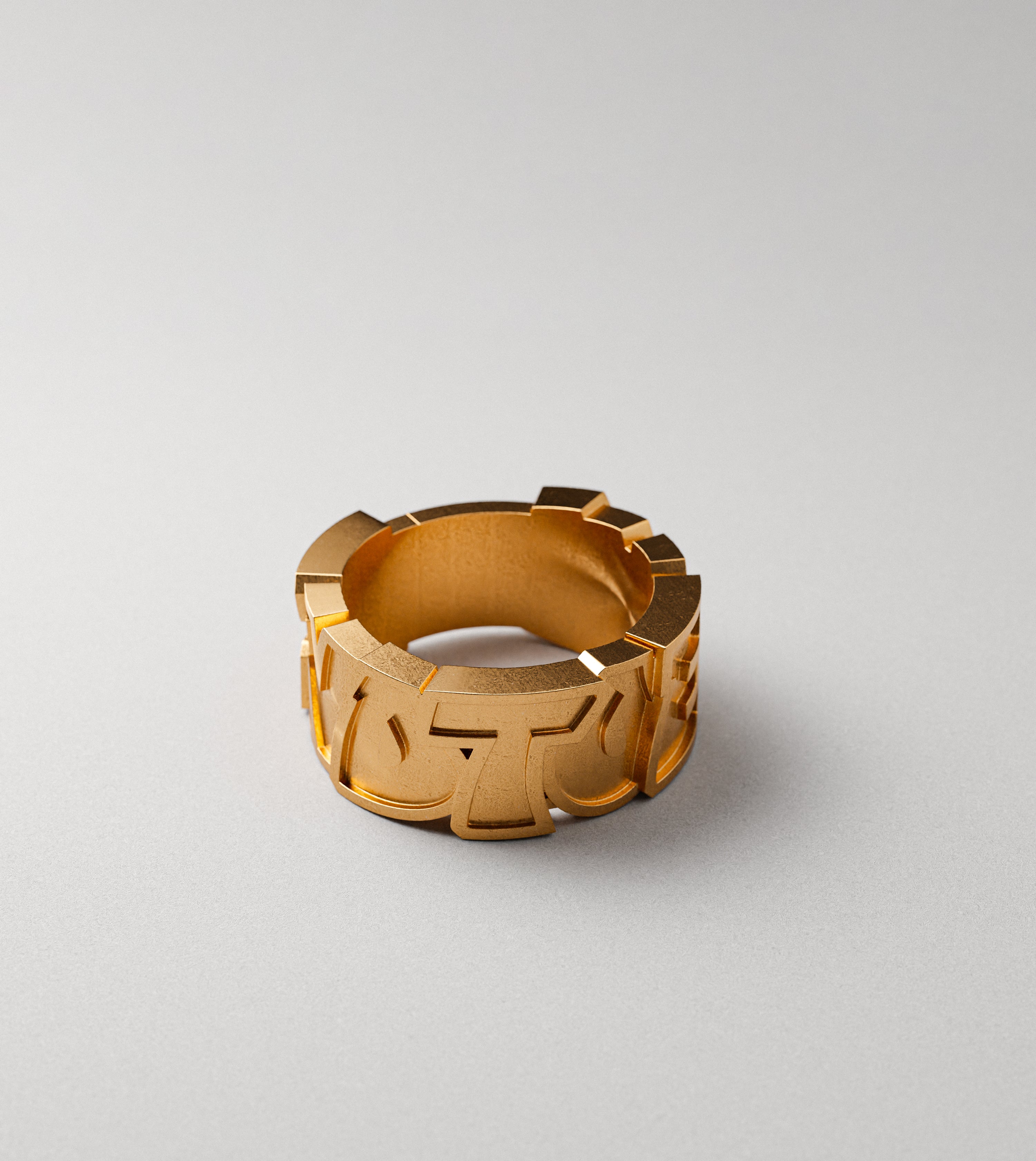 End to End block letters gold ring by Cast Pieces, side view