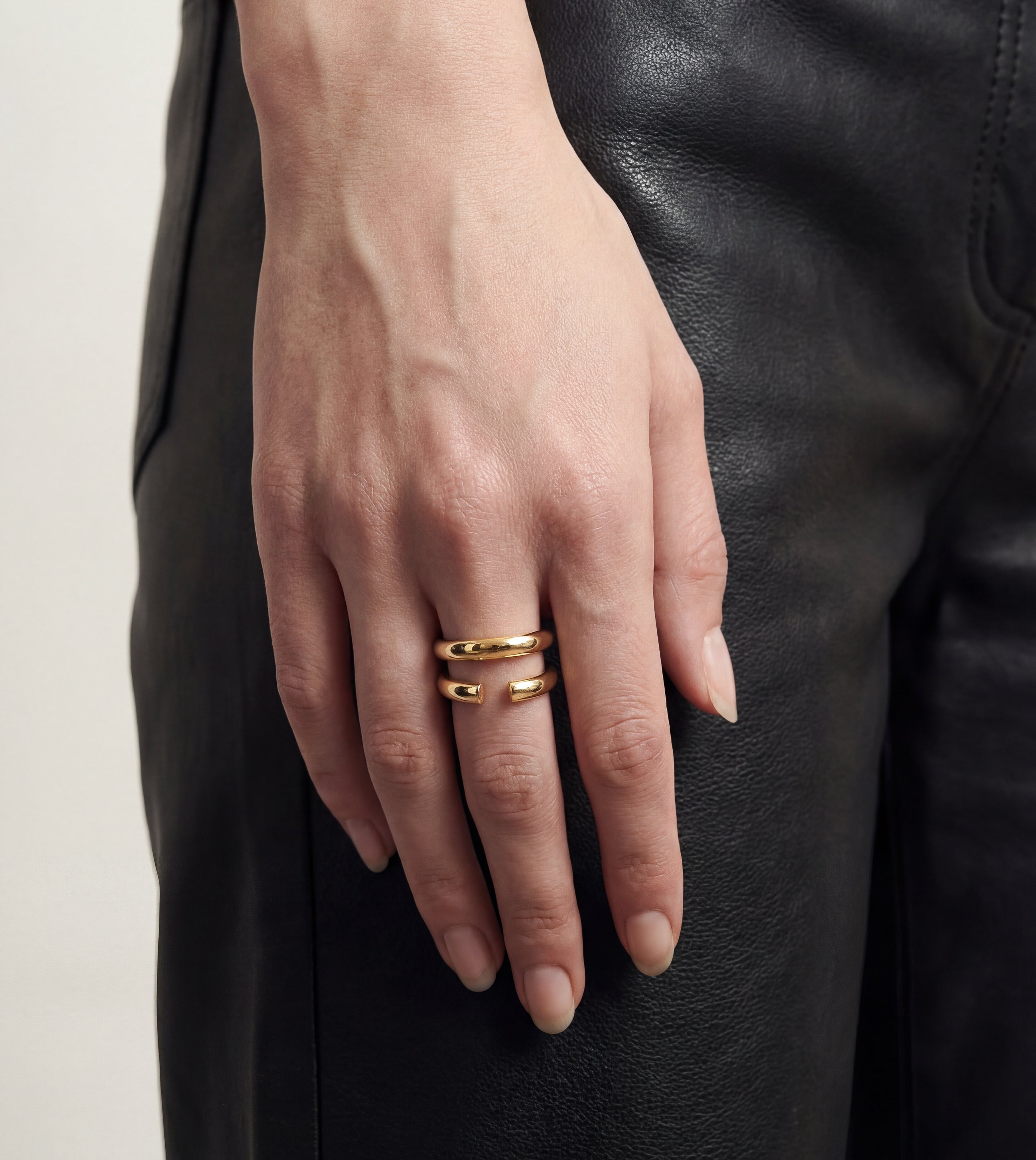 Soft Cap gold ring by Cast Pieces, worn by model