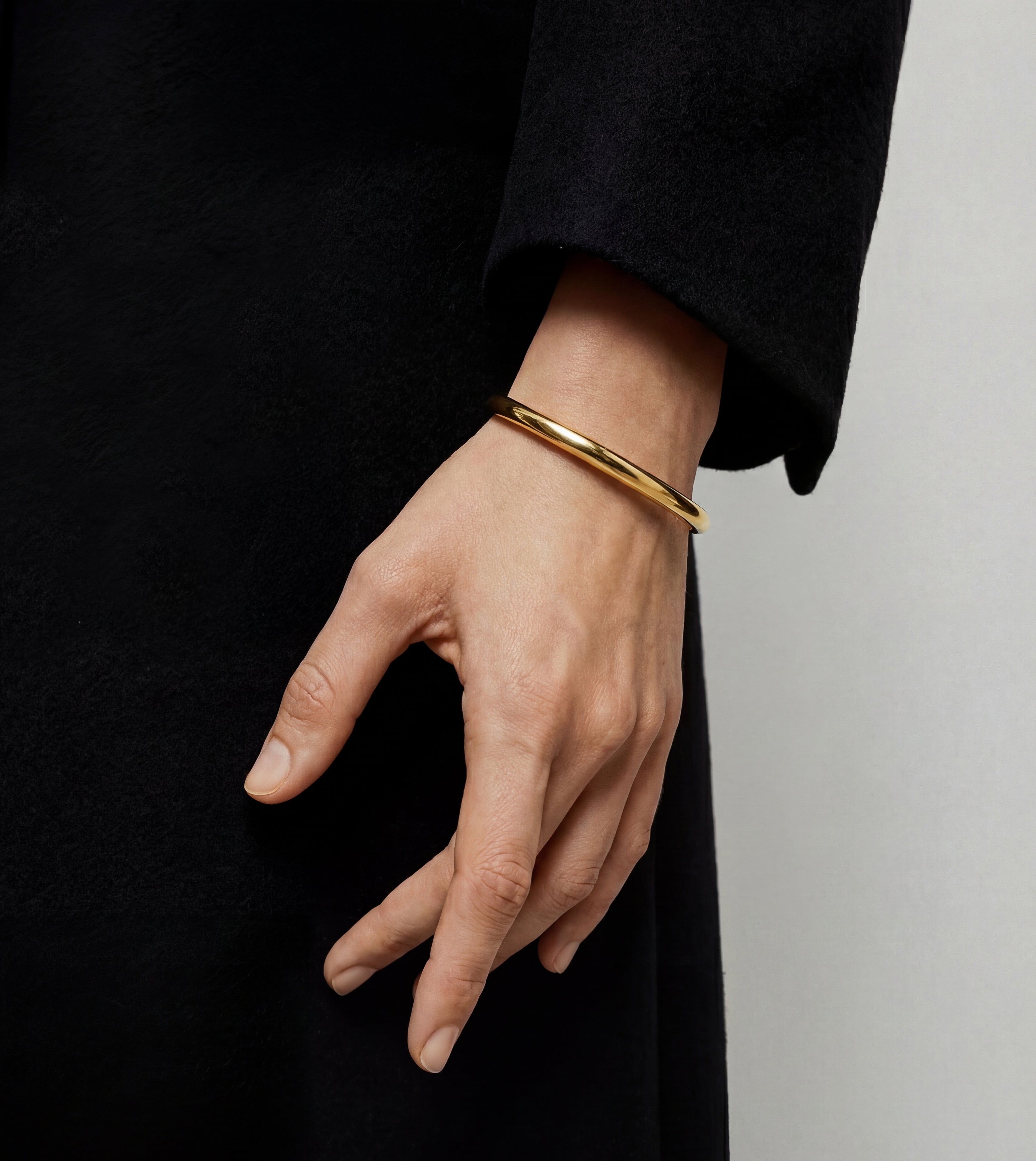 Soft Cap wide gold bracelet by Cast Pieces, side view