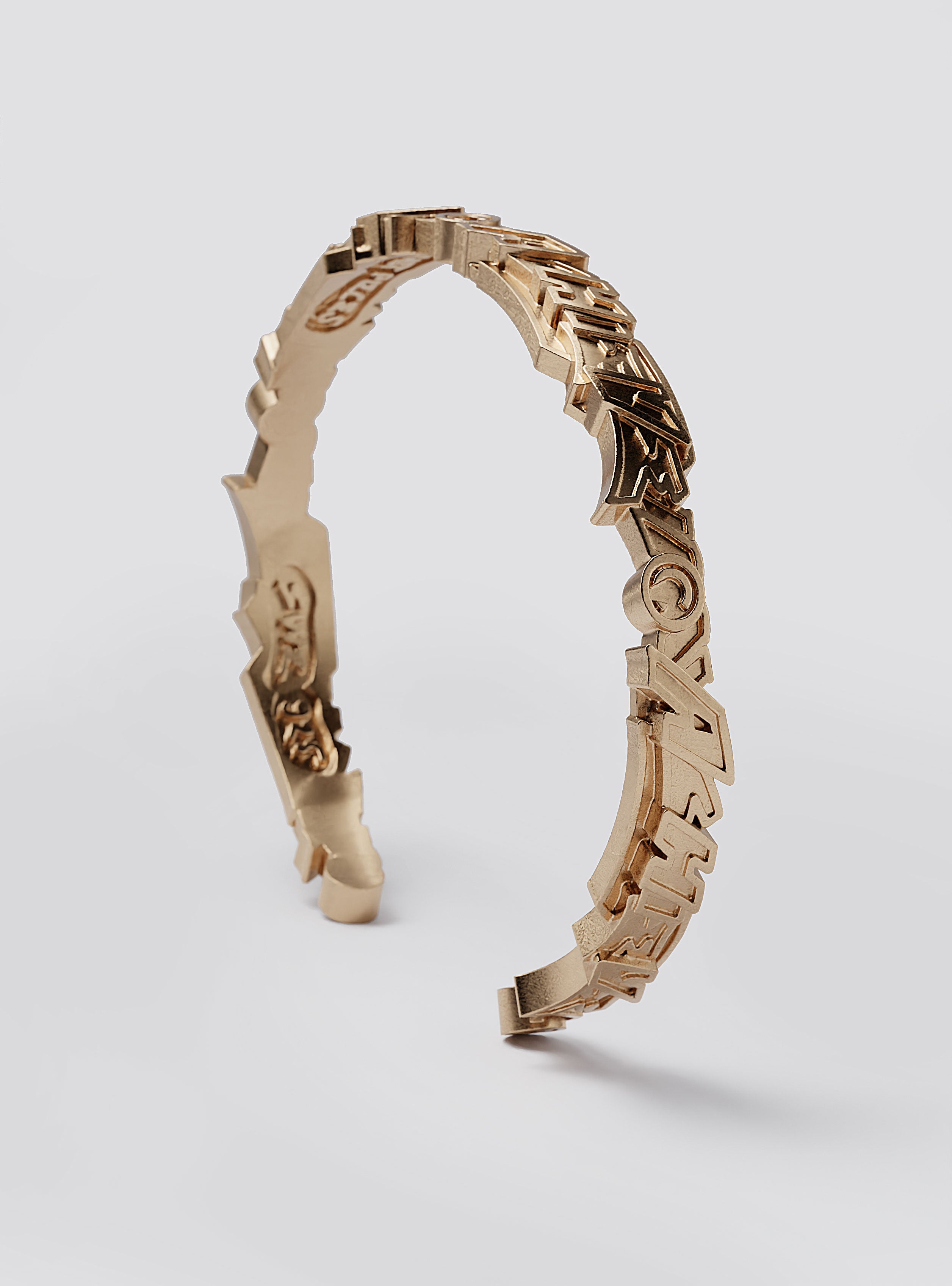 Cast Pieces Achieve gold cuff bracelet on display, designer edgy jewelry by Castpieces