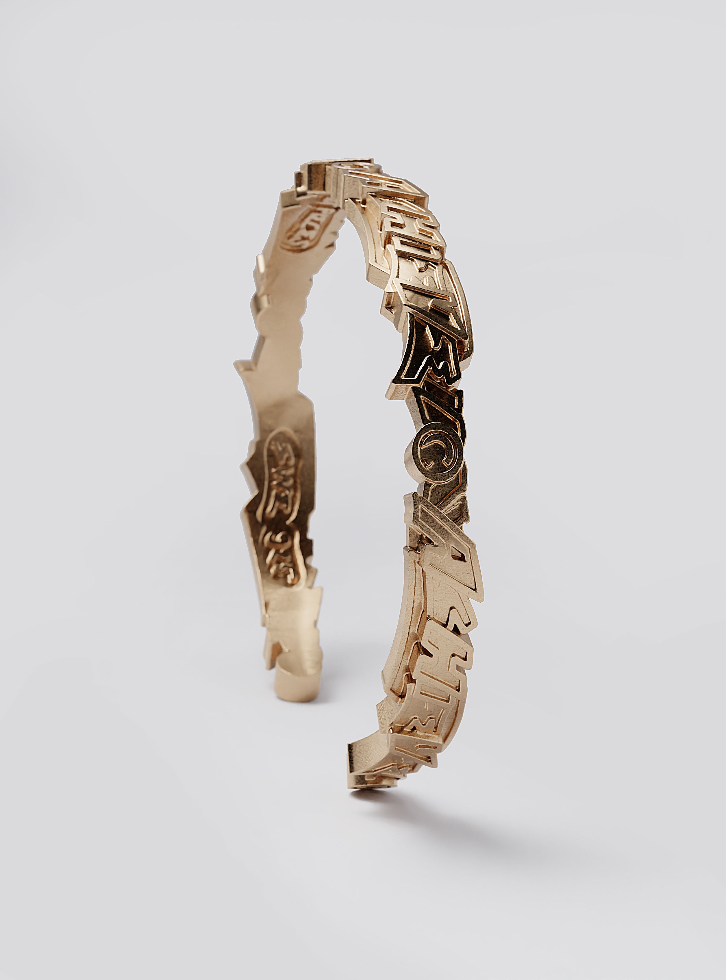 SidClose-up of Cast Pieces Achieve gold cuff bracelet, fine jewelry craftsmanship by Castpieces