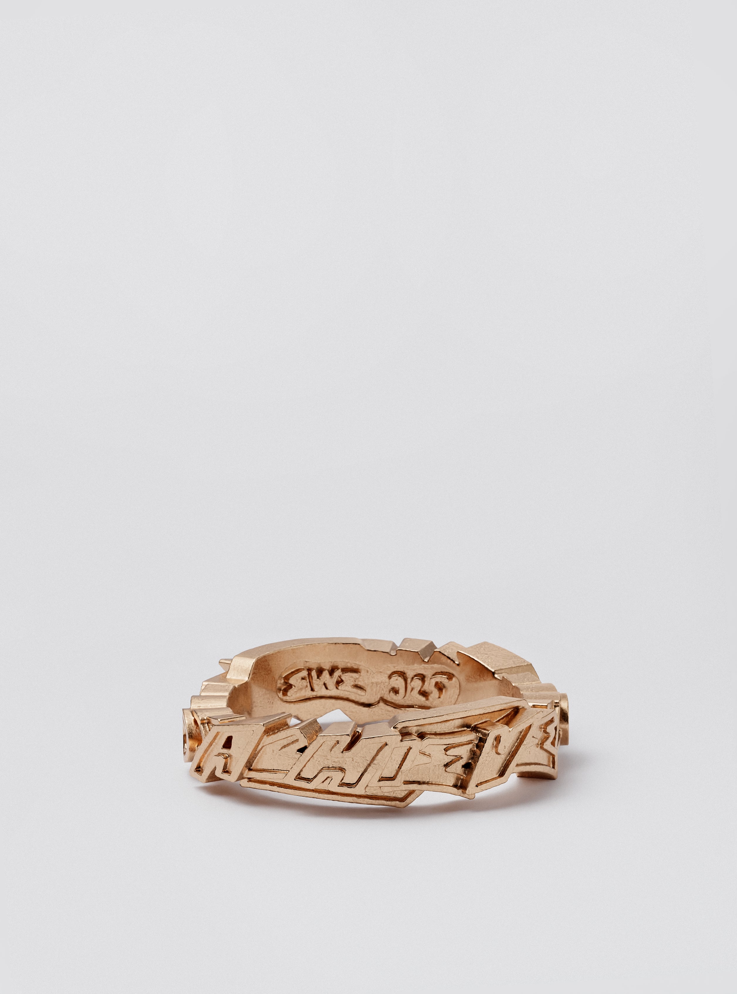 Close-up of Cast Pieces gold Achieve narrow ring, edgy graffiti-inspired jewelry by Castpieces