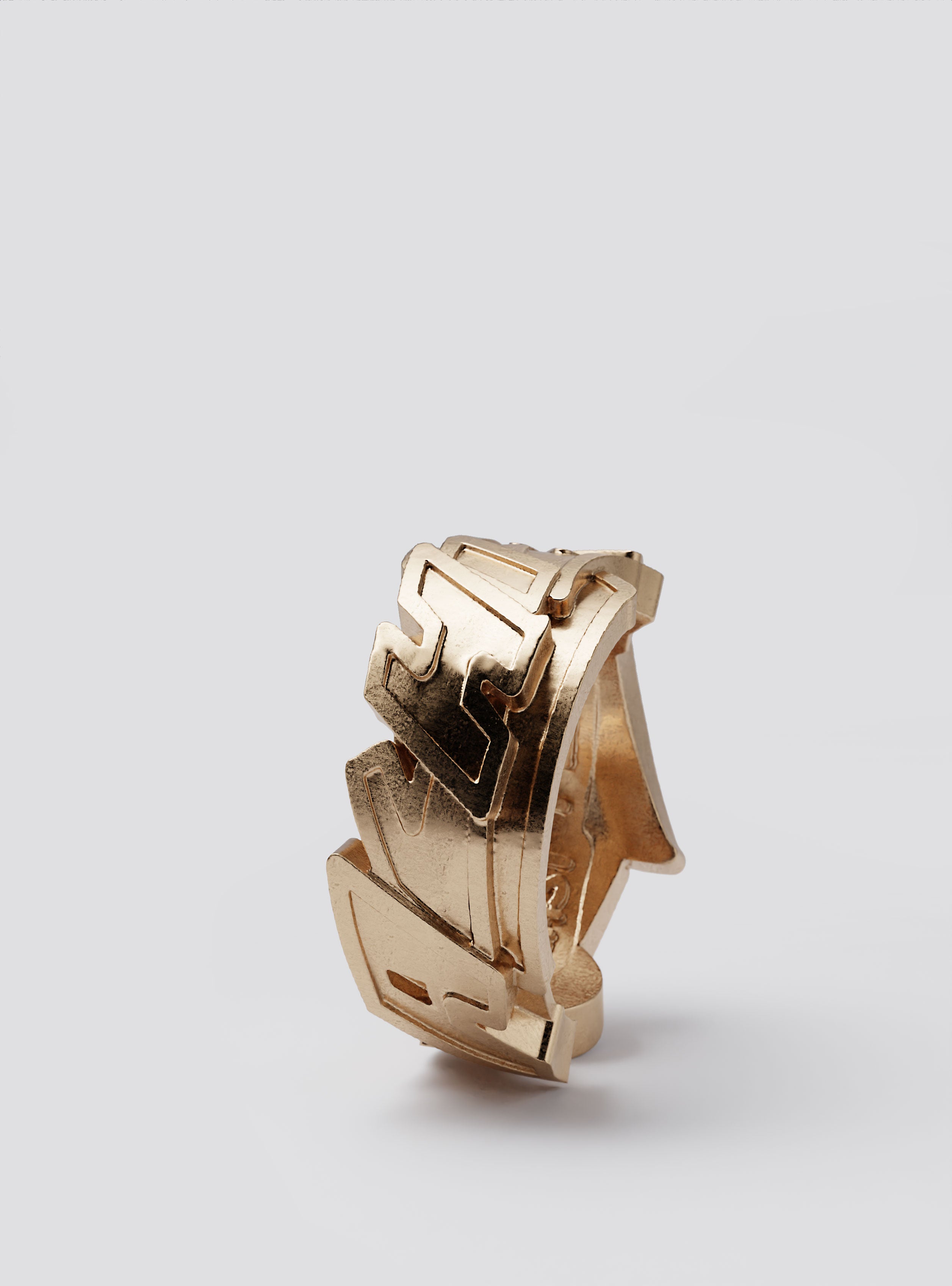 Close-up of Cast Pieces gold Achieve wide ring, edgy graffiti-inspired jewelry by Castpieces