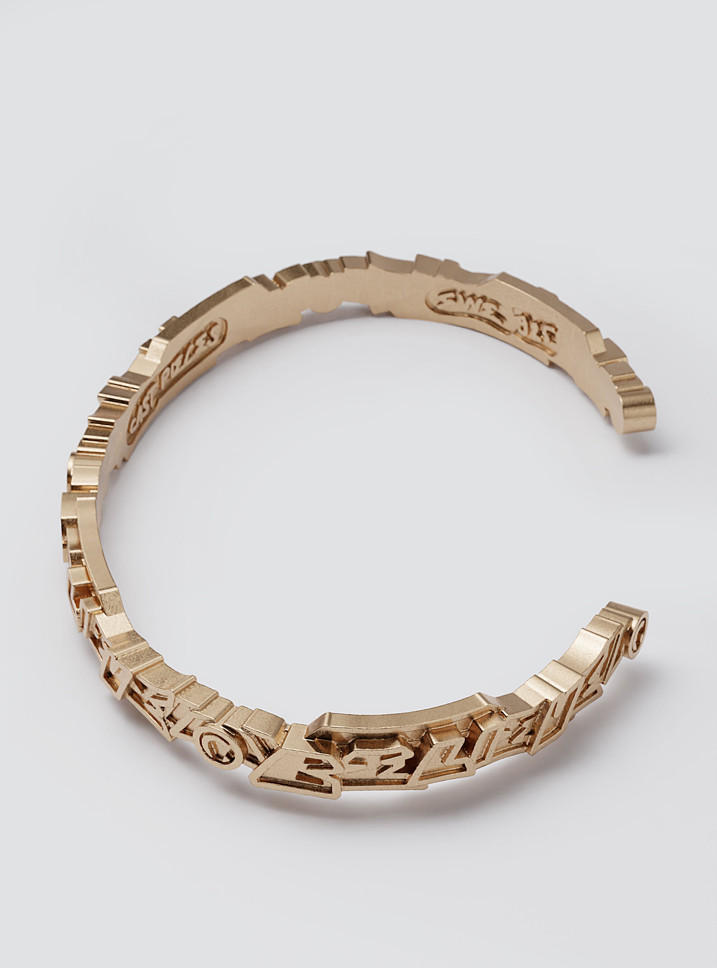 Cast Pieces gold Believe cuff bracelet, narrow and edgy, aesthetic handcrafted jewelry by Castpieces