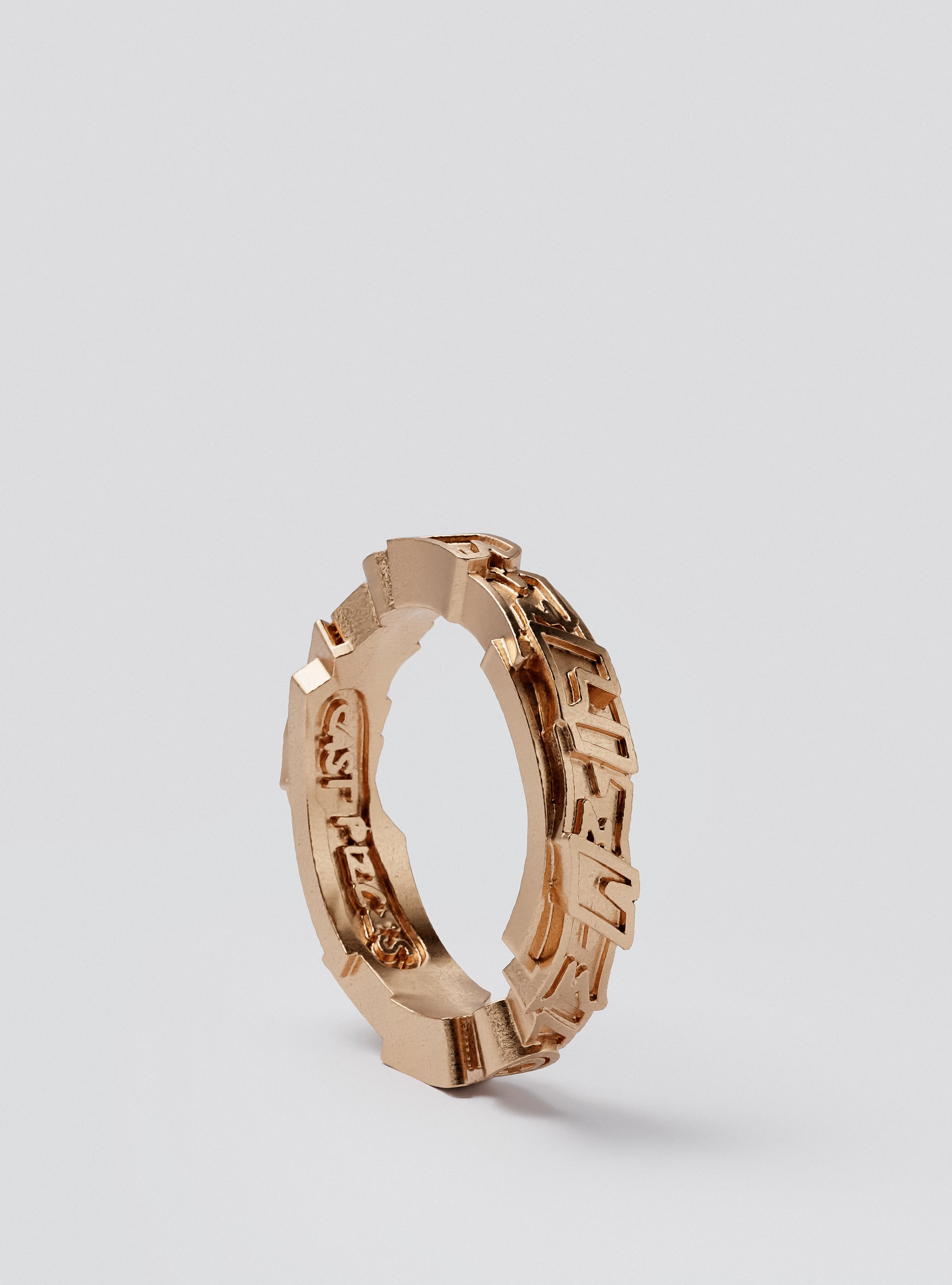 Side view of Cast Pieces gold Believe ring, narrow and modern street style jewelry by Castpieces