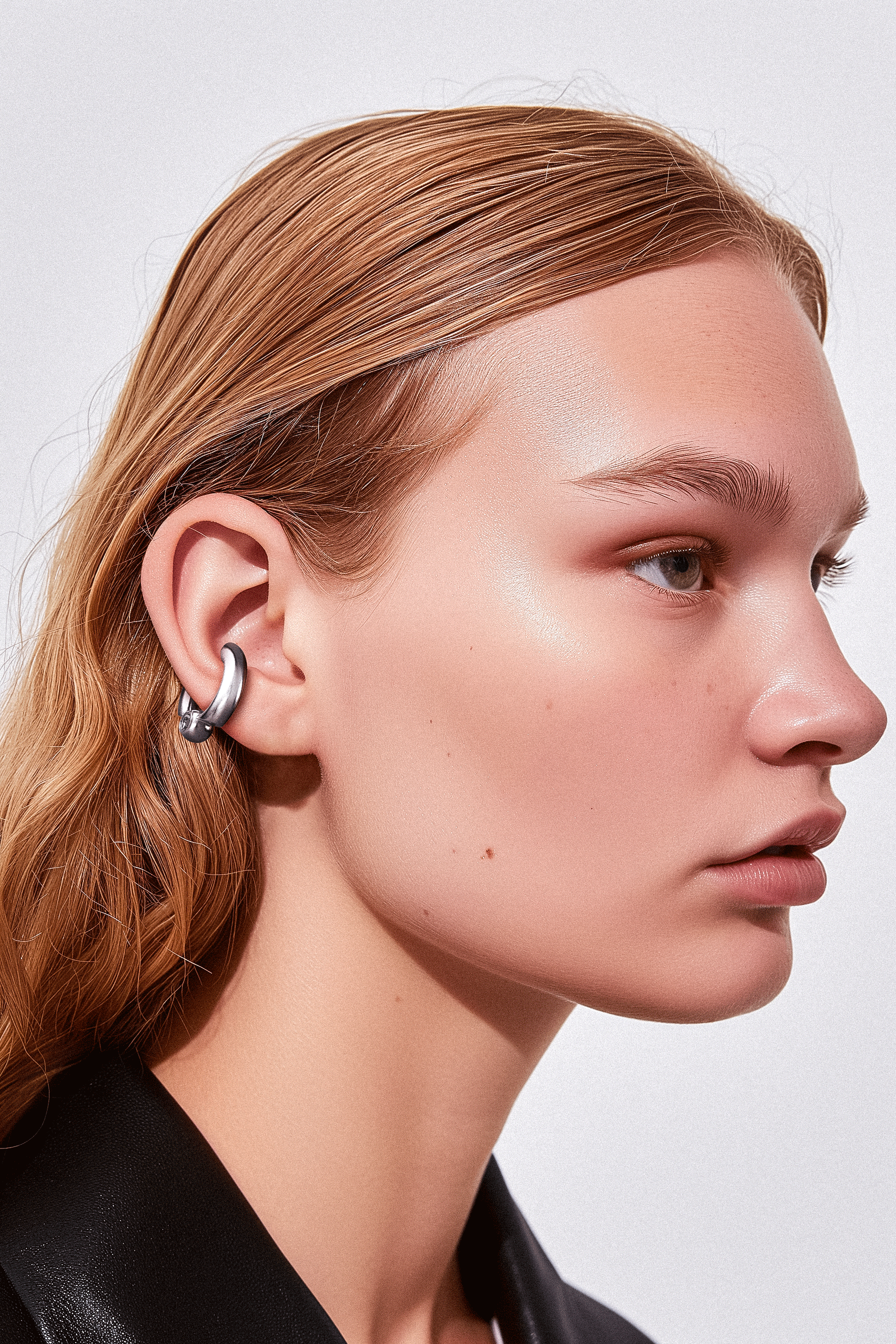 Model wearing Cast Pieces silver Ballcuff earring, trendy graffiti-style jewelry by Castpieces