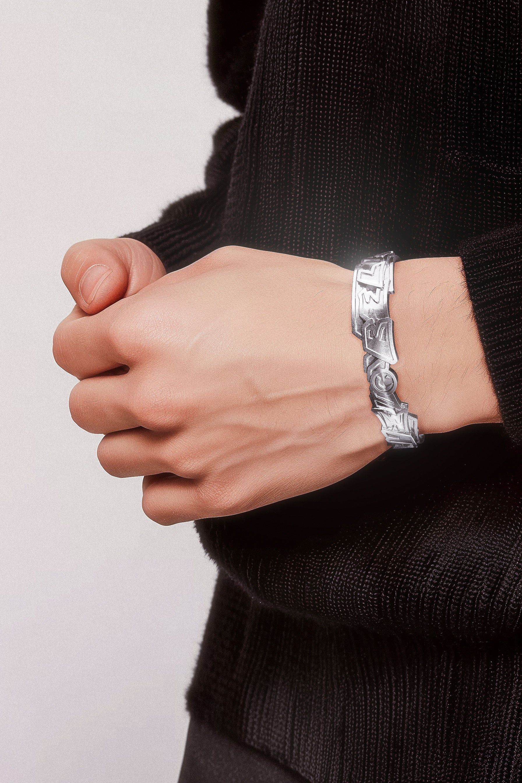 Model wearing Cast Pieces silver Believe wide cuff bracelet, trendy street style jewelry by Castpieces