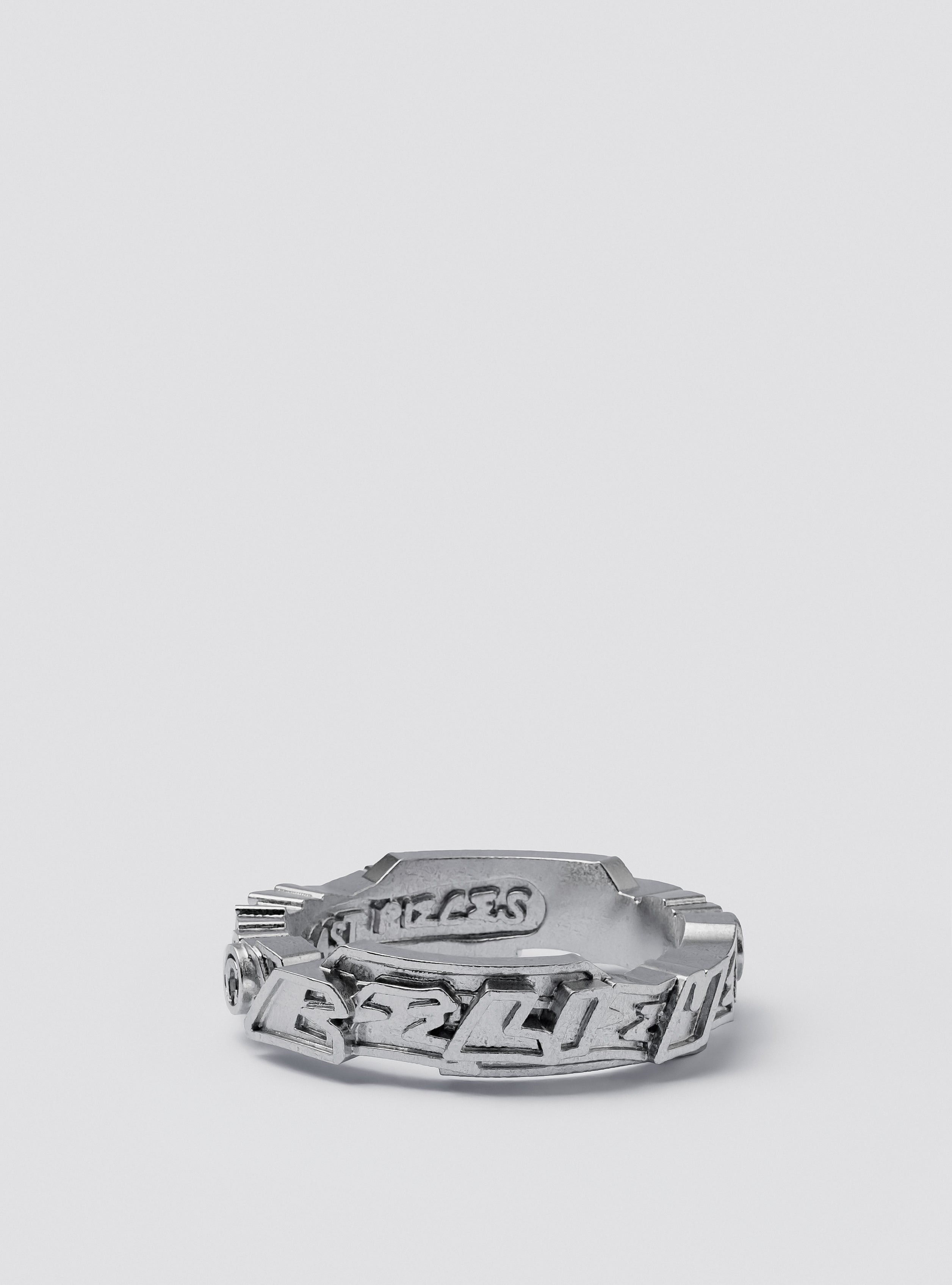 Side view of Cast Pieces silver Believe ring, narrow and modern street style jewelry by Castpieces